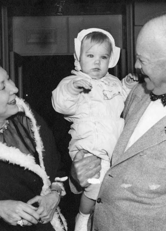 Dwight D Eisenhower with his grand daughter 